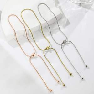 Adjustable snake chain bracelets in rose gold, gold, and silver with sliding bead closure
