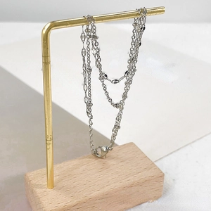 Silver stainless steel double-layered chain bracelet with flat oval charms and lobster clasp