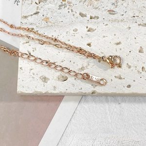Double-layered 18k rose gold stainless steel bracelet with lobster clasp and K18 tag