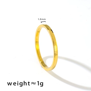 Detailed view of 1.8mm gold-toned titanium ring with hammered texture and 1g weight