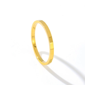 Minimalist gold faceted stainless steel ring with a polished geometric mirror finish
