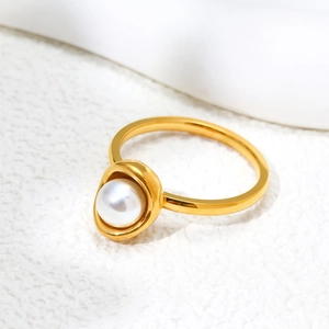Elegant gold pearl ring with a minimalist eggshell design in shiny stainless steel finish