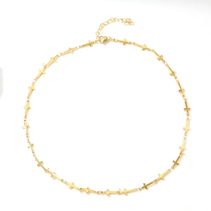 Hip hop style gold plated stainless steel necklace featuring continuous cross pendants