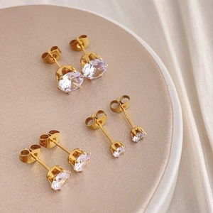 Set of three sizes gold plated cubic zirconia stud earrings with classic claw setting