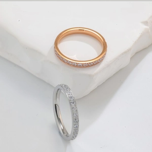 Detail of eternity rings in rose gold and silver with micro-pave crystal settings