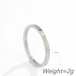 Minimalist 2mm titanium steel ring with small sparkling stone in silver finish