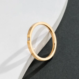Minimalist gold titanium steel thin ring with a single small sparkling zircon stone