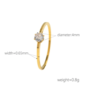 Minimalist gold six-prong ring with a 4mm round zircon stone on an ultra-slim band