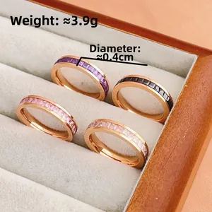 Rose gold ring with princess cut stones in purple, black, pink and white gems
