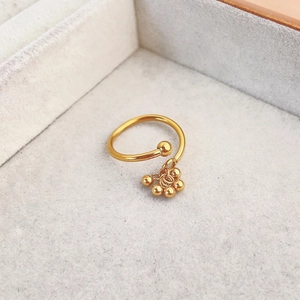 Detailed shot of adjustable gold-plated S925 ring featuring five hanging metal beads