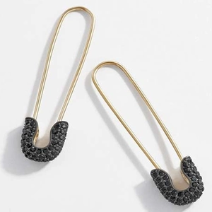 Detail of gold safety pin earrings with black pavé micro-set cubic zirconia crystals
