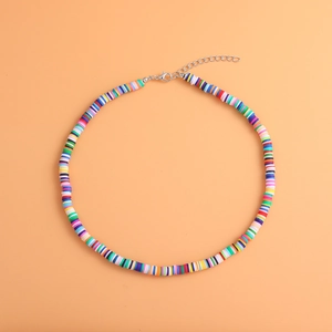 Detailed view of colorful Heishi clay bead necklace with lobster clasp and extender chain