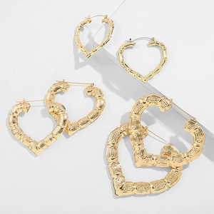 Three-piece set of 14K gold bamboo textured heart hoop earrings in varying sizes