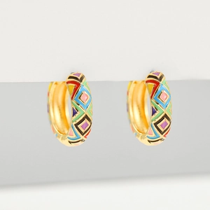 Macro detail of gold hoop earrings featuring colorful enamel geometric patterns and finish