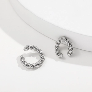 Silver twisted rope C-shaped ear cuffs set with minimalist metal finish in a studio shot