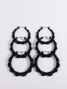 Three pairs of black bamboo-textured heart hoop earrings in graduated sizes set