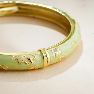 14K gold plated enamel flower bangle with light green base and floral relief ornaments