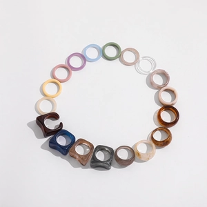 Set of colorful Y2K resin rings in various mocha and macaron tones for women