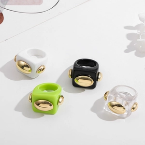 Chunky square resin ring set in four colors with golden oval metallic accents