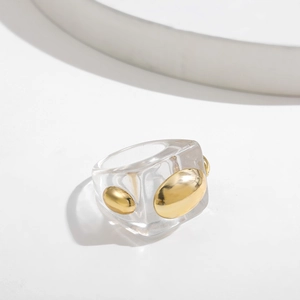 Modern transparent resin square ring with three gold metal beads in minimalist Y2K style
