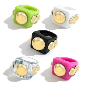 Chunky geometric resin rings with gold metal studs in vibrant Y2K candy jelly colors