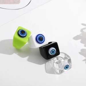 Modern square resin rings set with blue evil eye charms in green, white, black and clear