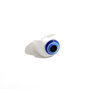 Macro detail of a white resin evil eye open ring with a blue and black circular bead