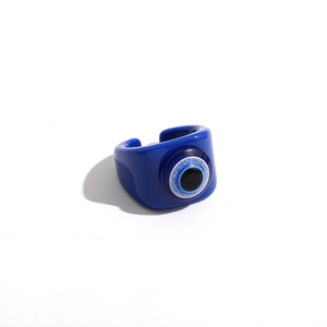 Detailed top view of a dark blue resin evil eye open ring with shimmering white accents