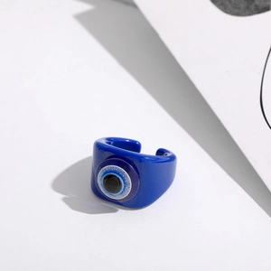 Macro shot of Klein blue resin evil eye open ring with fine glitter detailing