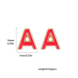 Detail of red enamel letter A stud earring in gold metal with size measurements