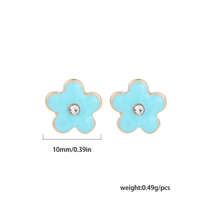 Detail of 10mm light blue enamel flower earring with white rhinestone and gold plating