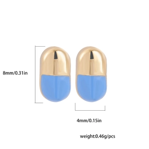 Close-up of gold and blue pill-shaped stud earrings with 8mm by 4mm size dimensions