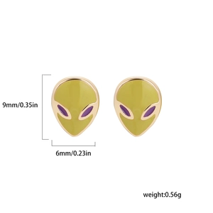 Macro shot of yellow alien stud earrings with dimensions 9mm by 6mm on white background