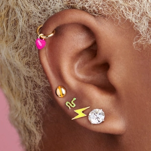 Detailed view of colorful Y2K enamel earrings set with butterfly and heart charms