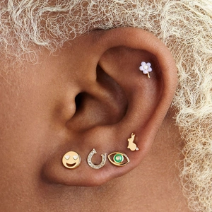 Close-up of five-piece Y2K stud earring set with colorful enamel and crystal details