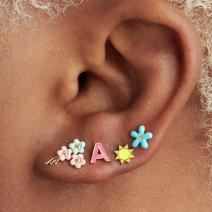 Detailed view of Y2K colorful enamel earrings with flower and letter A studs