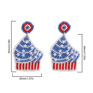 Detailed view of beaded cupcake earrings with size measurements in red white blue colors
