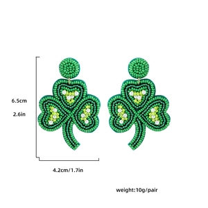 Detailed view of beaded shamrock earrings with dimensions 6.5cm by 4.2cm and 10g weight