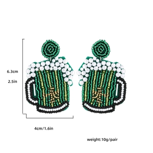 Detailed size view of handmade green beaded beer mug earrings for Saint Patrick's Day