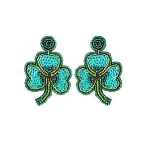Close-up of handmade green sequin shamrock earrings for Saint Patrick's Day party