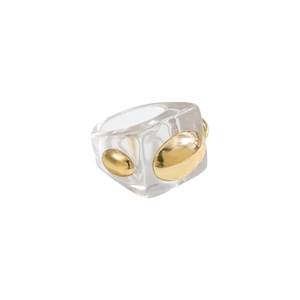 Macro detail of clear resin ring featuring embedded polished gold metal oval beads