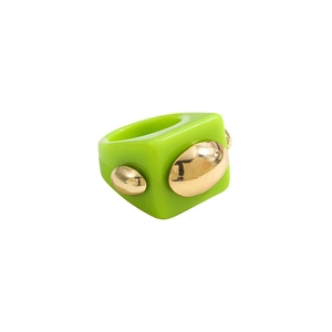 Close-up of a green chunky resin ring featuring three gold metallic beads in Y2K style