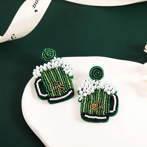 Saint Patrick's Day green beaded beer mug earrings with white pearl foam accents