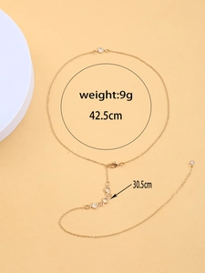 Detalle de cadena corporal de oro de 14K con piedras turquesas y dimensiones peso 9g