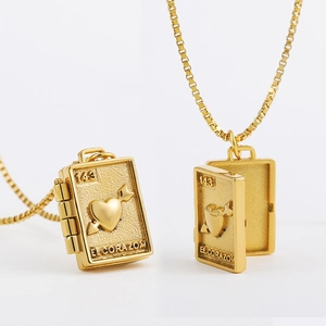 Locket book pendant necklace in gold finish with heart motif and box chain link