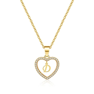 Detailed macro view of heart pendant with letter D and cubic zirconia inlays