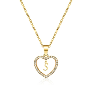 Detail of gold heart pendant with cubic zirconia and dangling letter S on O-chain