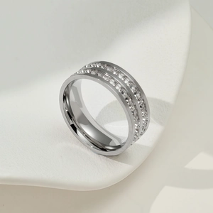 Modern silver ring with double-row rectangular crystal stones on a white background