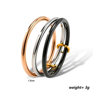 Three-band interlocking ring in rose gold, silver, and black polished titanium steel