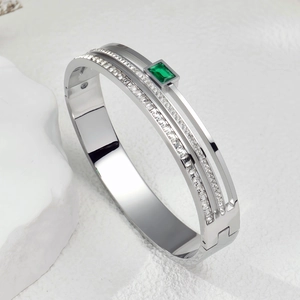 Elegant titanium steel bracelet featuring rectangle emerald and micro-paved diamonds